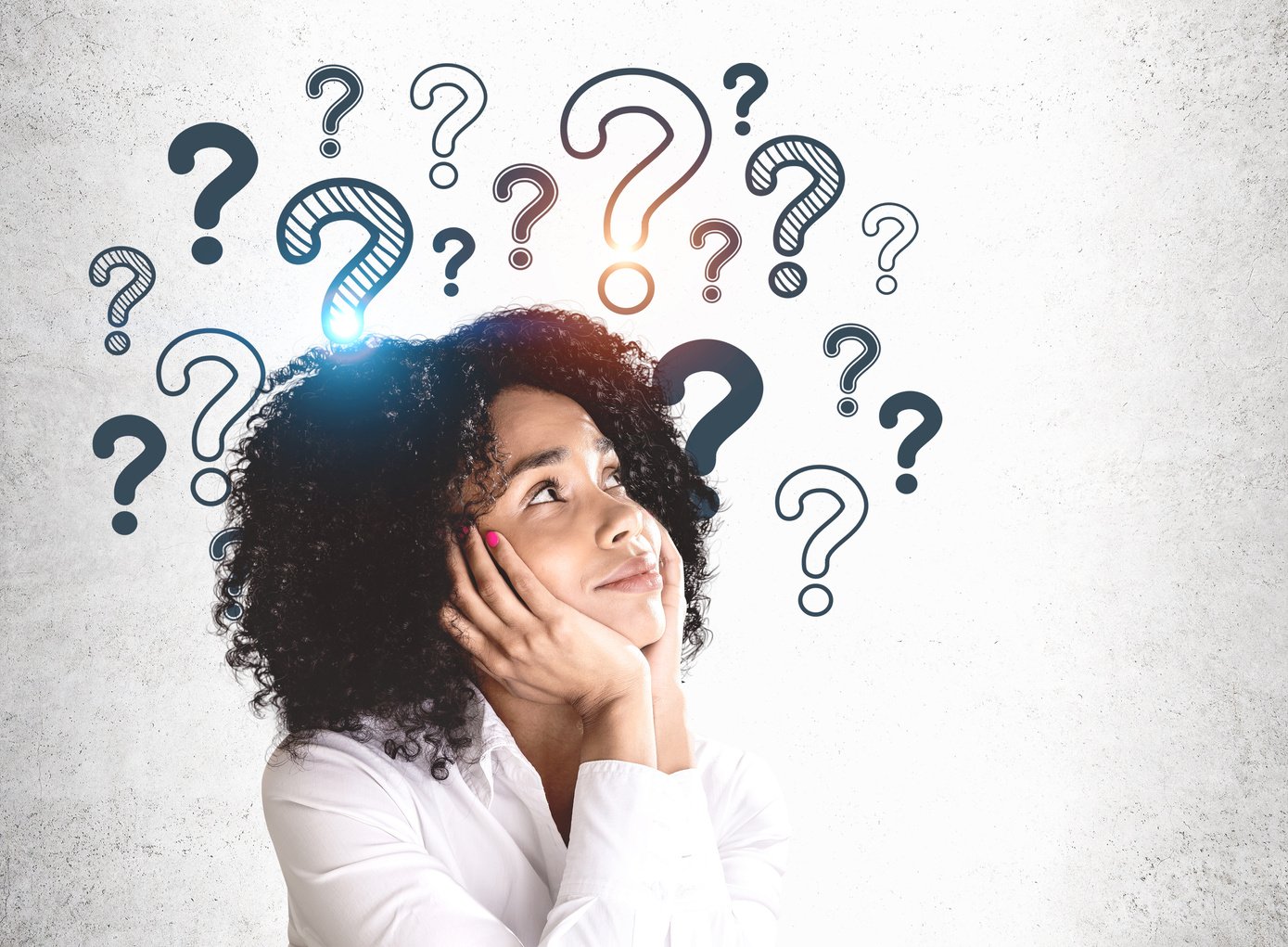 Young African woman and question marks